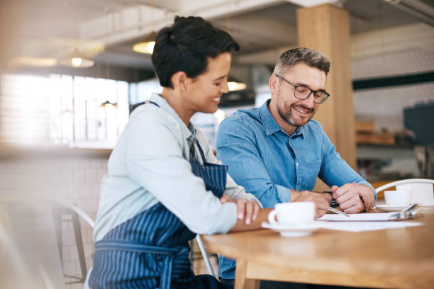 istock Processing their coffee shop's monthly income and expenditure 841179978