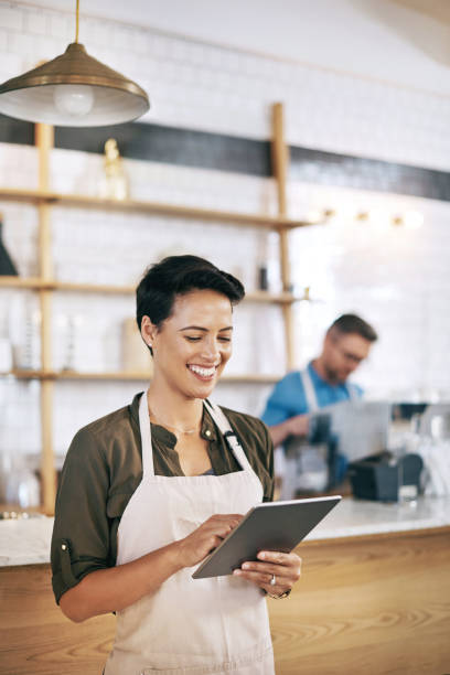 istock Digitizing her daily coffee shop duties 841180126