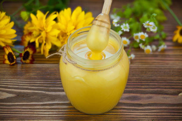 istock Delicious delicious honey in  jar on table 841181348