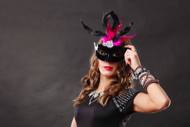 istock Woman with carnival venetian mask on dark 841181966