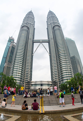 KUALA LUMPUR, MALAYSIA - August 30: The Famous Petronas Twin Towers in Malaysia on August 30, 2017 in Kuala Lumpur. Petronas Twin Towers are twin skyscrapers and were tallest buildings in the world from 1998 to 2004.