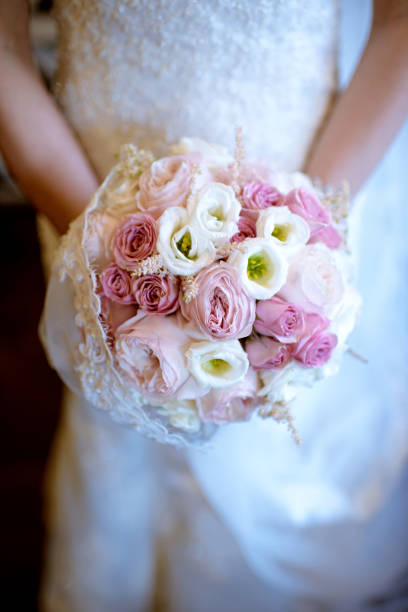 istock Beautiful bride is holding a wedding colorful bouquet 841187830