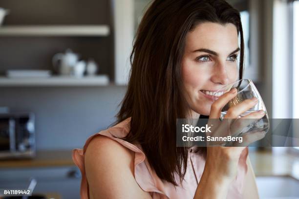 Beautiful Woman In Kitchen Stock Photo - Download Image Now - Water, Drinking Water, Drinking