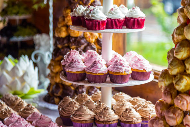 istock Dessert table for a party. Ombre cake, cupcakes. Candy bar 841192232