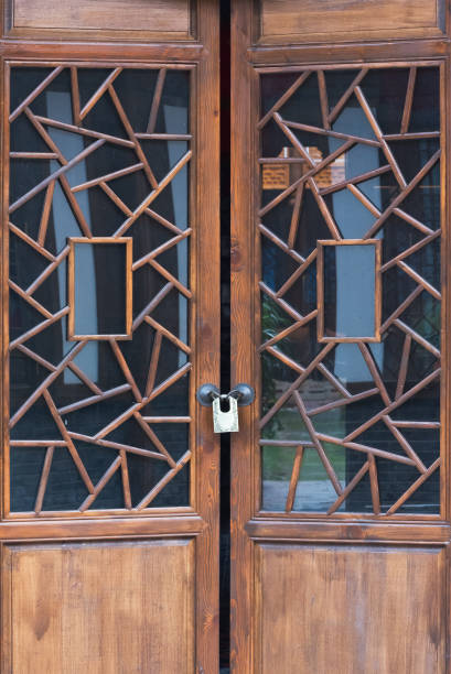 istock Wooden door locked with decorative glass 841192488