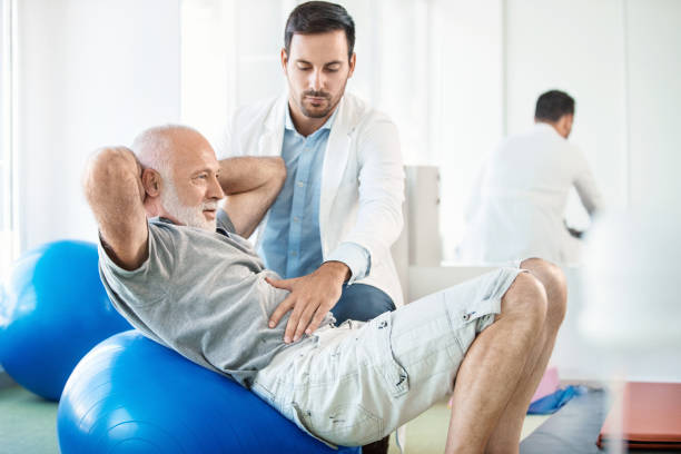 istock Senior man in physical rehab. 841195640