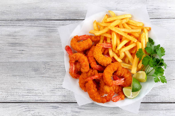 istock breaded Fried Shrimps with french fries 841199276