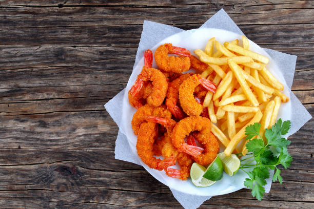 istock breaded Fried Shrimps with french fries 841199756
