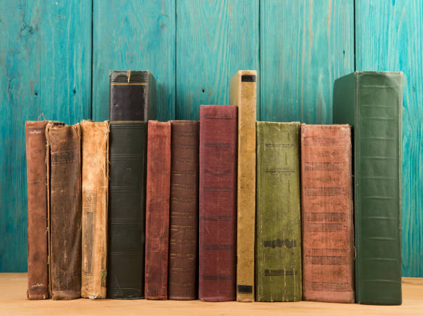 istock Open book on wood planks over abstract light background 841206996