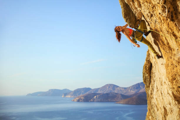 istock Cheerful female climber on challenging route 841208448