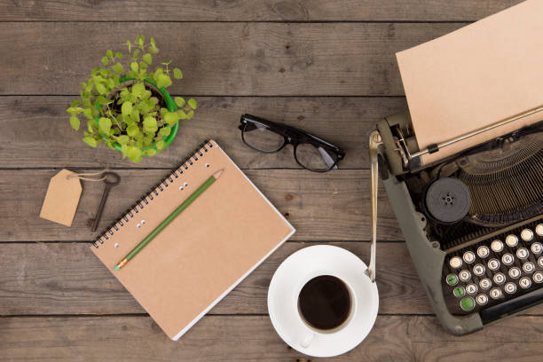 istock Vintage typewriter on the old wooden desk 841214142