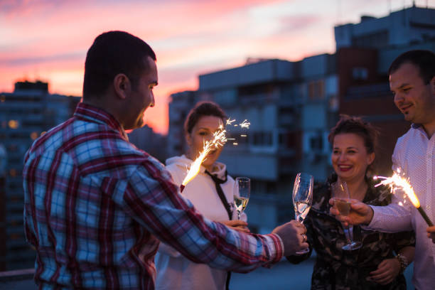 istock Rooftop party with sparklers and champagne 841214698