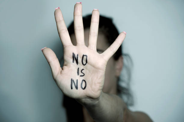 istock woman showing a note with the text no is no 841214882