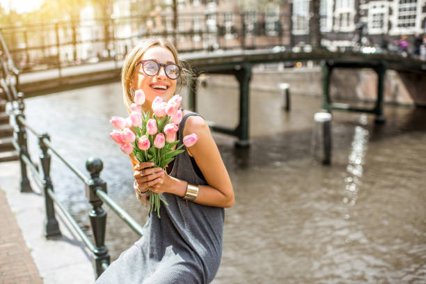 istock Woman with bicycle in Amsterdam city 841215076