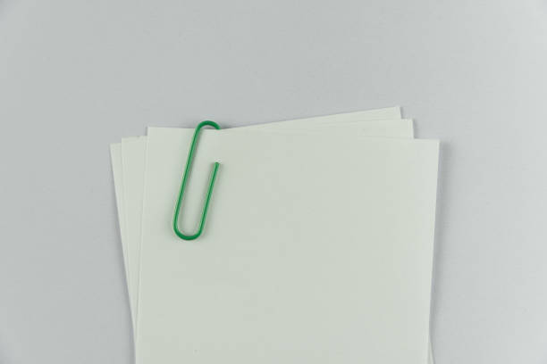 istock white note paper with red paper clip 841218838