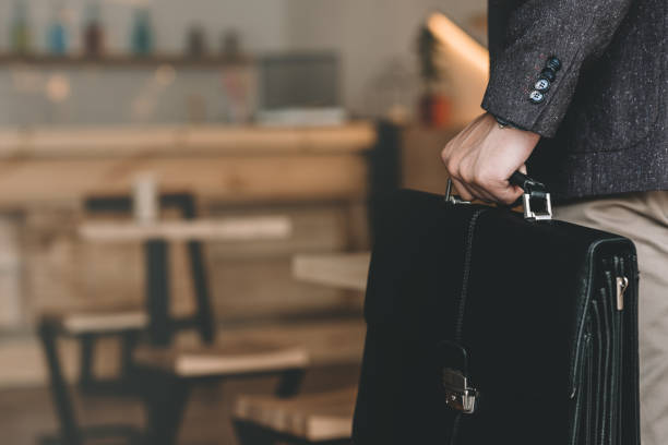 istock businessman with suitcase in cafe 841218966