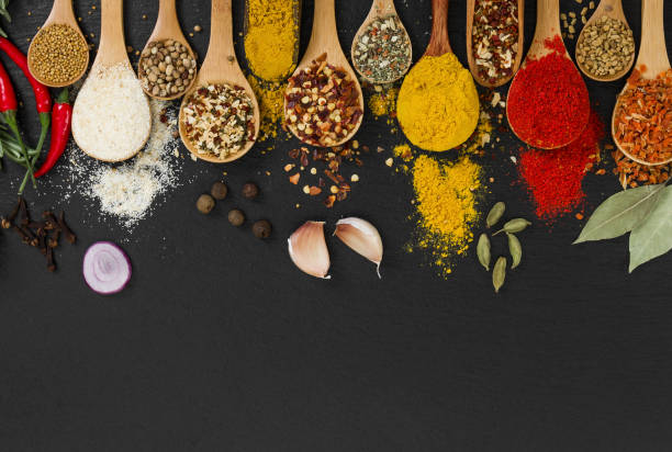 istock Different spices in wooden spoons. Top view. 841226210