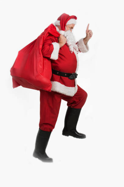istock Santa Claus with a sack walking and pointing 841229012