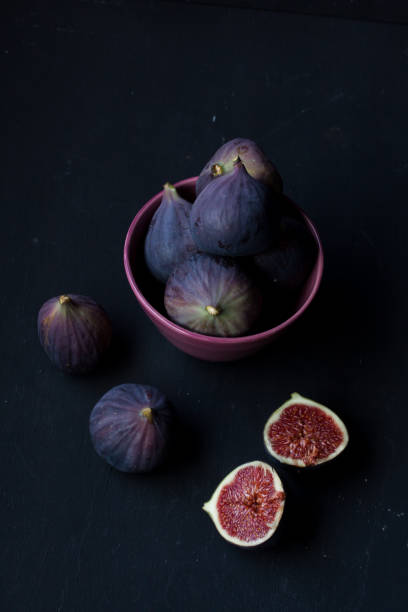 istock figs in a bowl on a black background 841230030