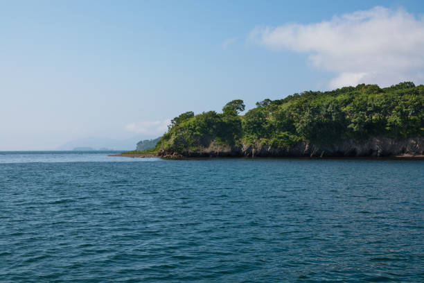istock Sea Landscape. Green Cape Over Ocean Surface. 841230426