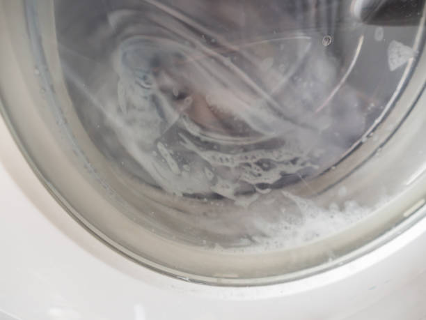 istock Closeup of washing machine spinning. 841234250