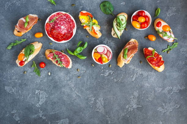 istock Traditional spanish tapas on black background. Flat lay, top view 841235218