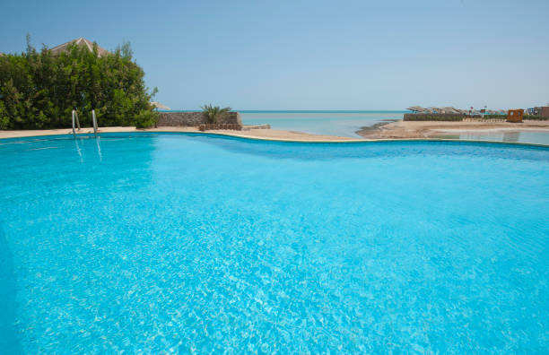 istock Swimming pool at at luxury tropical holiday villa 841246774