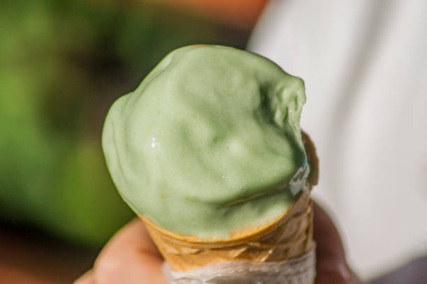 istock pistachio ice cream in boy's hand 841253654