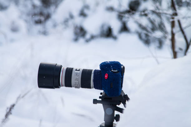 istock Hand knitted woolen mitten for DSLR camera for using in winter 841254280