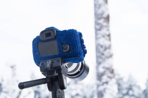 istock Hand knitted woolen mitten for DSLR camera for using in winter 841254482