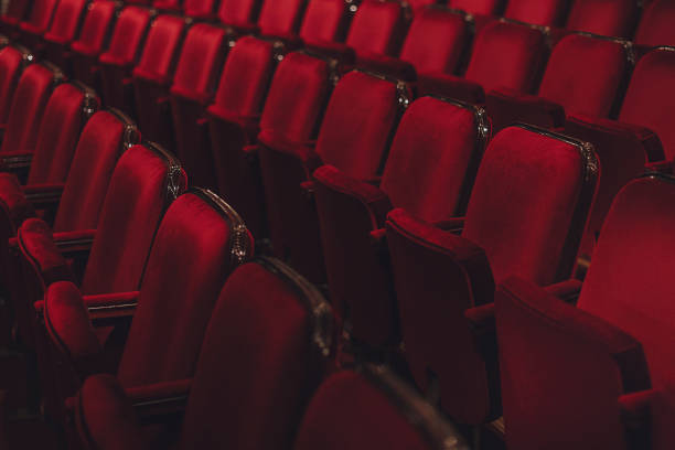 Empty red theather seats in a row Empty red theather seats in a row, cimena or opera theather stock pictures, royalty-free photos & images