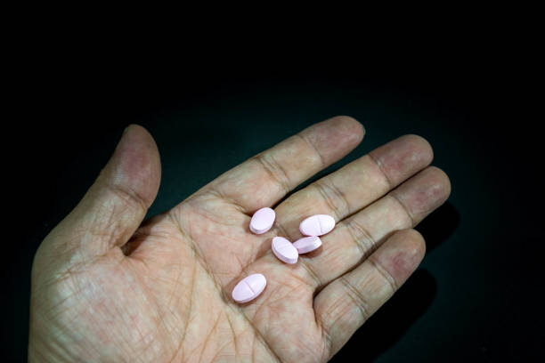 istock Close up of hand holding  tablets 841257692