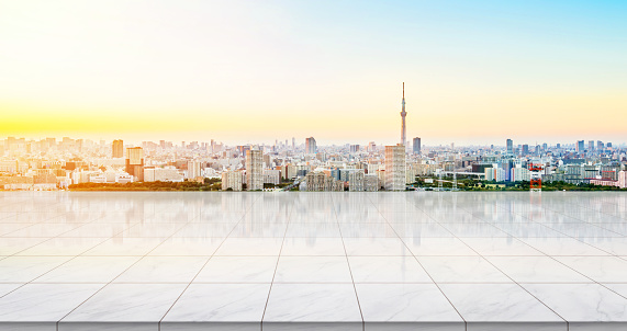 Business concept - Empty concrete floor top with panoramic modern cityscape building bird eye aerial view under sunrise and morning blue bright sky of Tokyo skytree, Japan for display or montage product