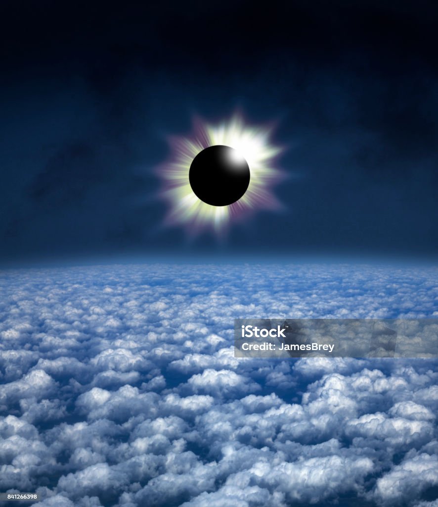 Spectacular total solar eclipse as seen from above the clouds. Spectacular total solar eclipse as seen from above the clouds, aerial view. Solar Eclipse Stock Photo