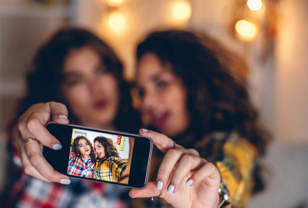 istock Two young girls taking selfies at home 841272354