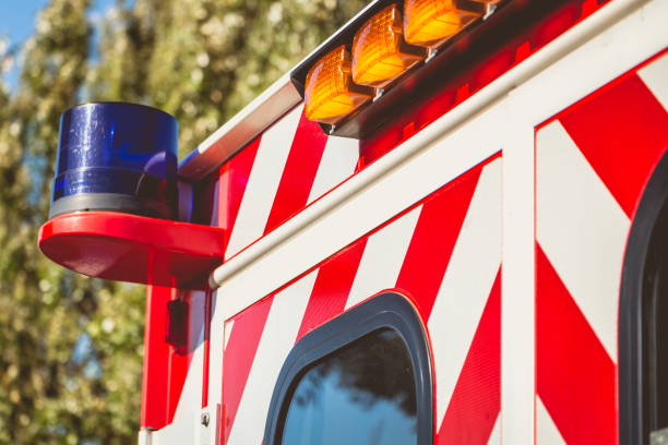 istock blue flashing light on a red ambulance 841273274