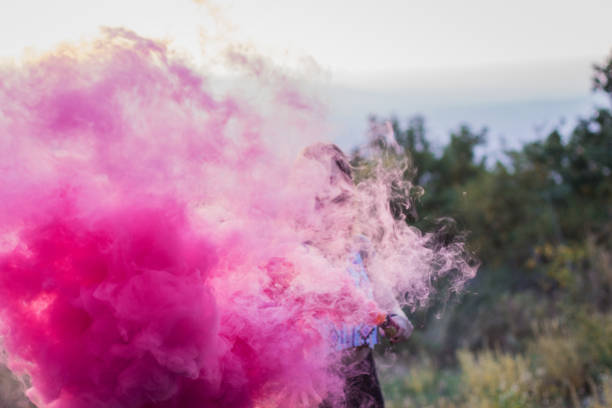 istock Girl in a red smoke cloud 841275352