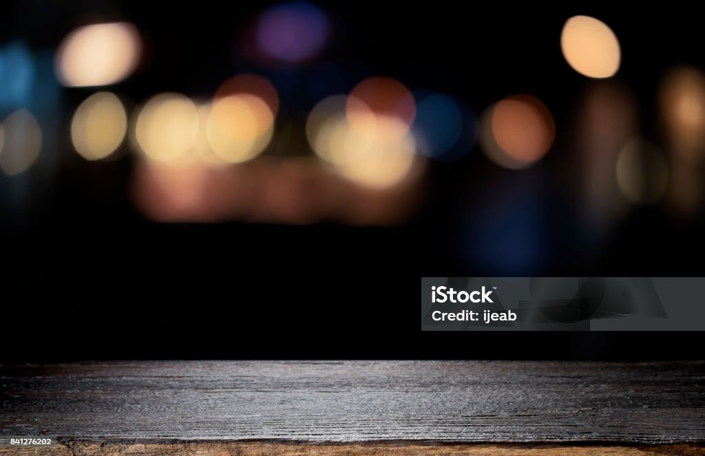 Empty wooden table platform and bokeh at night Table Stock Photo