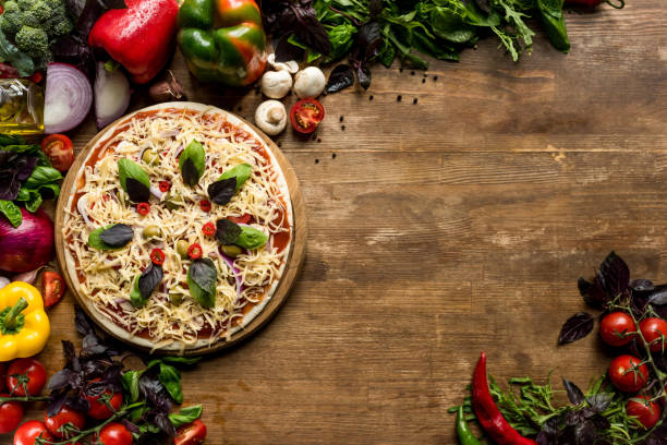 istock raw homemade pizza with ingredients 841276284