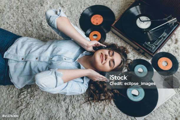 Young Woman Enjoing Music From Gramophone Stock Photo - Download Image Now - Record - Analog Audio, Music, Listening