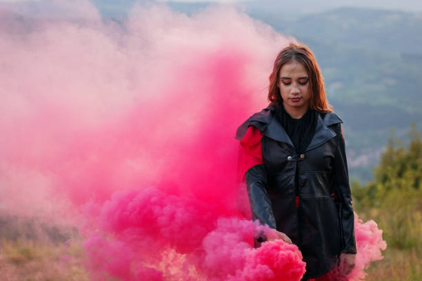 istock Girl in a red smoke cloud 841278590