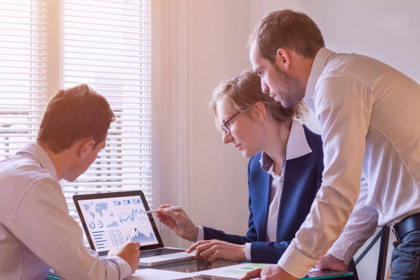 istock Team of finance people discussing charts and KPI, computer screen 841278644