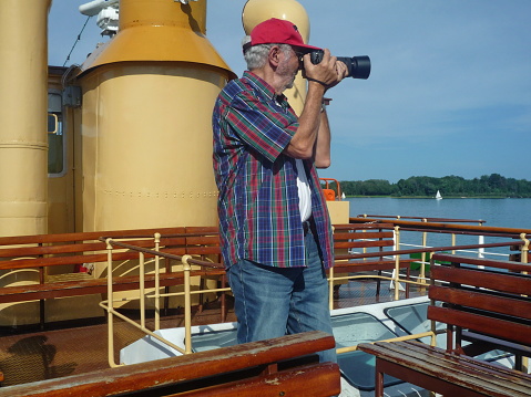 Senior photographed from the deck of paddlewheel steamers 