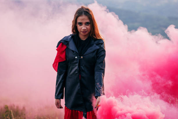 istock Girl in a red smoke cloud 841279356