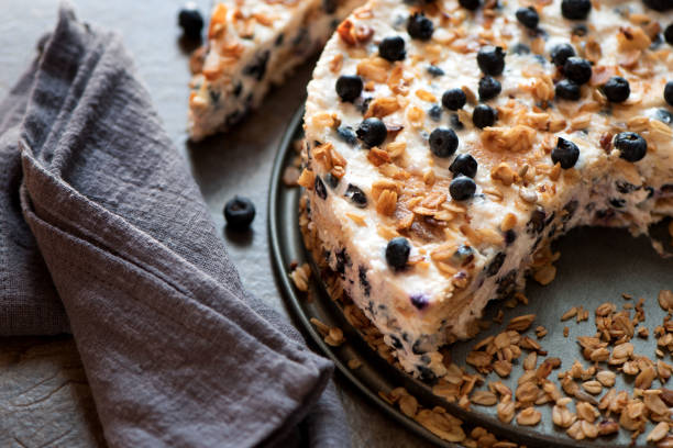 Sour cream cake with granola, biscuits and blueberries
