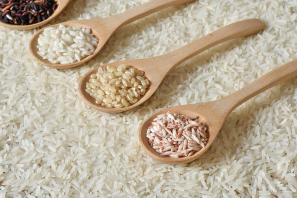 istock Top view different rice on wooden spoon with jasmine rice 841282192
