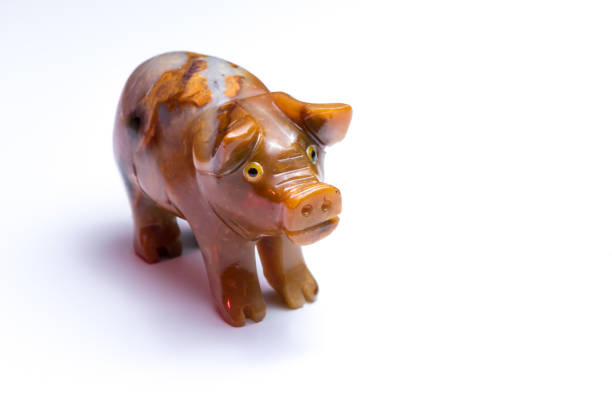 istock figurine of a pig standing on a white table 841284386