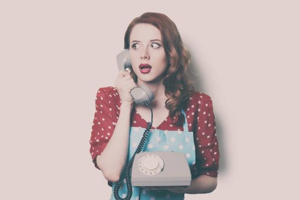 istock woman with retro phone 841293900