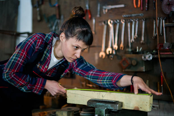 istock Female Carpenter Working In Repairshop 841297928