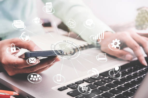 istock business using smart phone application global marketing on desk office with technology virtual icons interface. 841300640